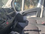 the interior of a van with the driver ' s seat folded down