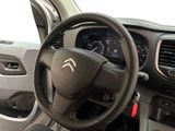 a steering wheel and dashboard of a small car