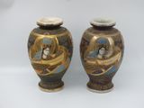 two vases sitting side by side on a white surface