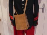 a mannequin dressed in red pants and a black jacket