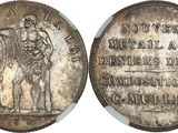 a close up of a coin on a white surface with a picture of a man on a horse