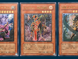 three cards with different designs on them on a blue background