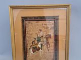 framed picture of a man riding a horse with a woman on it