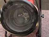 a small portable heater sitting on the ground