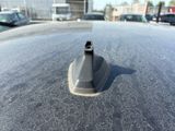 a close up of a parking meter on the hood of a car