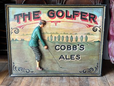 a sign that says the golfer cobb ' s ales on it