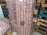 two pieces of luggage sitting on pallets in a warehouse