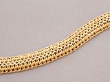 a gold chain bracelet with a clasp