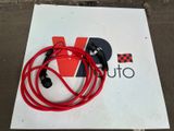 a sign with a red cord attached to it