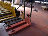 many forklifts lined up in a row on the floor