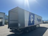 a semi truck that is parked in a parking lot