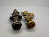 pair of antique brass door knobs on a white surface