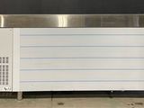 an image of a large freezer sitting on top of a sidewalk