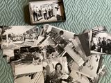 many black and white photos of people on a bed