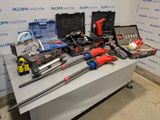 a table with tools on it in front of a wall