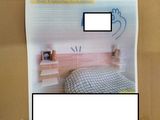 a cardboard box with a picture of a bed in it