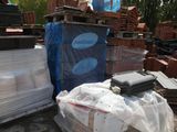 a pile of bricks sitting on top of a pile of plastic