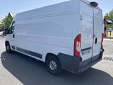 a white van that is parked in the parking lot