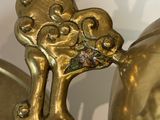 a gold vase that has a dragon on it
