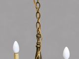 brass plated chandelier with five lights and a bell