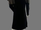 a black dress with fringes on a mannequin mannequin mannequin mannequin mannequin mannequin mannequin mannequin