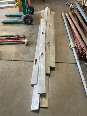 many pieces of wood that are laying on the floor