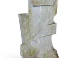 a close up of a stone sculpture on a white surface