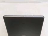 a close up of a laptop on a white surface