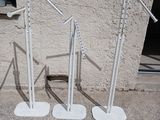 two white poles that are on the ground next to a building