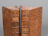 an old book shaped like a book with a bookmark on top of it