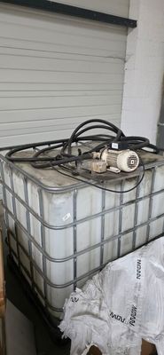 a large container of water sitting on top of a pallet