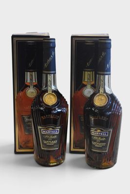 two bottles of liquor are sitting next to each other on a table