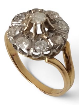 an image of a gold ring with a cluster of diamonds on it