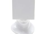 a white plate with a card on top of it