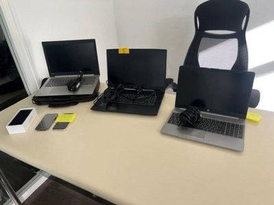 three laptops sitting on a table next to each other