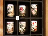 a display case with a lot of cups on it
