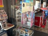 a glass display case with a lot of items inside of it
