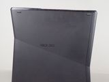 a black laptop sitting on a table with a white background