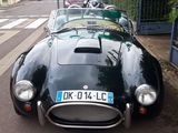 a black sports car parked on the side of the street