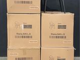 boxes stacked on top of each other with a chair on top of them