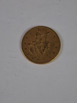 a gold coin with a picture of a man on it