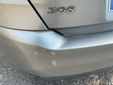 a close up of a car ' s rear end with a number plate on it