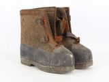 a close up of a pair of boots on a white surface
