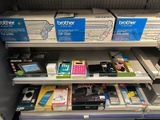 many different types of electronics on the shelves in the store