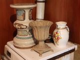 two vases sitting on top of a stove in the kitchen
