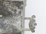 a metal object with a seahorse on it