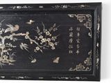 a picture of a black tray with flowers and birds on it