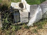 a pile of concrete blocks sitting on the side of the road