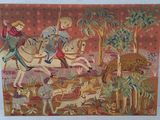 painting of a man riding on a horse with animals in the background