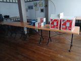 a table with boxes on it and a laptop on it